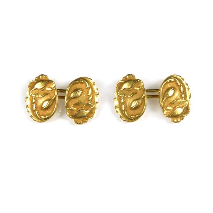 Pair of antique oval gold cufflinks with raised poppy detail